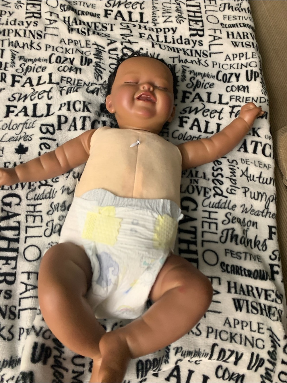 Smiling Brown Baby Doll in Cream Top and White Diaper - Playtime Doll